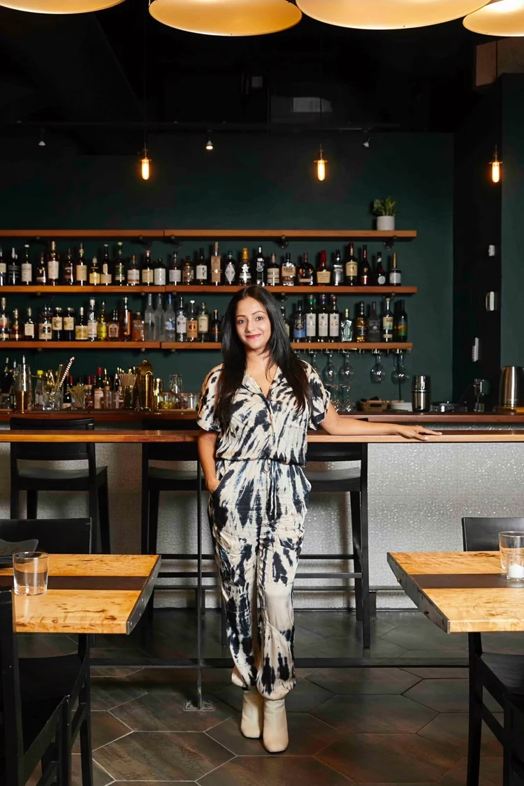 Chef Preeti Agarwal standing at the Kricket Club bar